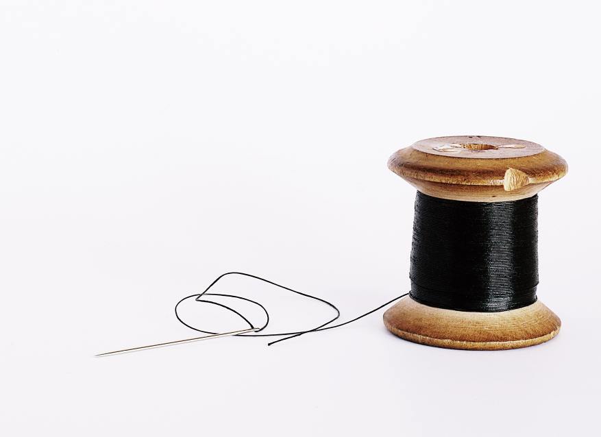 black-thread-on-a-wooden-spool-2564554